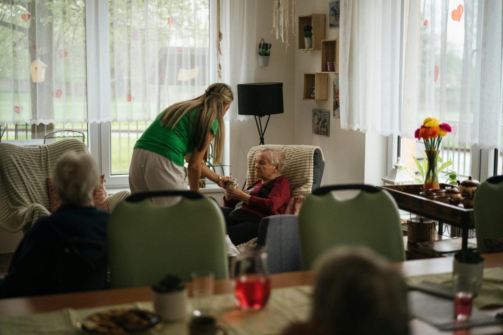caregiver giving support to a senior citizen women